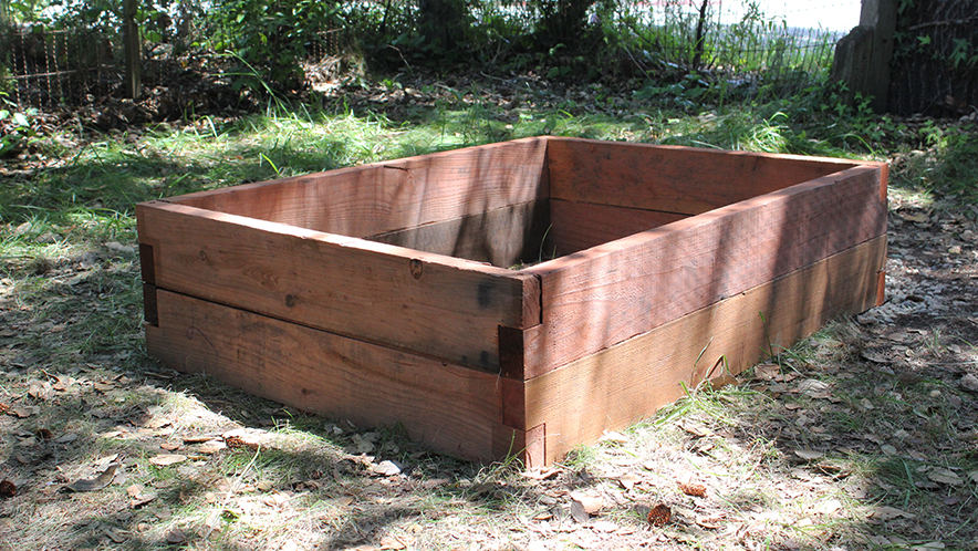 aised garden bed made from untreated wood, ready for planting in a shaded backyard—ideal for DIY vegetable gardening, organic growing, and sustainable living at UrbanGardenWorkshop.com
